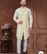 Light yellow & cream embroidered indo-western sherwani set with thread, stone & fancy button work.