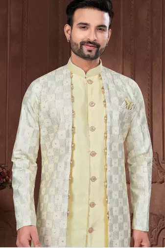 Light yellow & cream embroidered indo-western sherwani set with thread, stone & fancy button work.