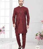 Maroon embroidered jacket attached indo-western sherwani set with thread, stone & fancy button work.