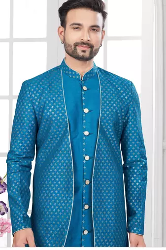 Blue embroidered jacket attached indo-western sherwani set with thread, stone & fancy button work.