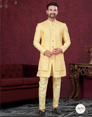 Yellow embroidered jacket attached indo-western sherwani set with thread, stone & fancy button work. 1
