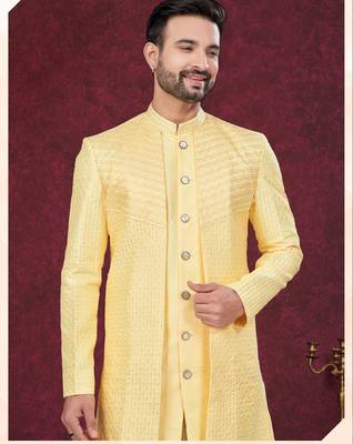 Yellow embroidered jacket attached indo-western sherwani set with thread, stone & fancy button work. 2