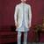 Grey gold  embroidered jacket attached indo-western sherwani set with thread, stone & fancy button work.