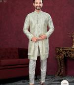 Green off white embroidered jacket attached indo-western sherwani set with thread, stone & fancy button work.