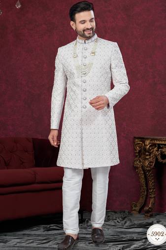 Grey off white embroidered jacket attached indo-western sherwani set with thread, stone & fancy button work.