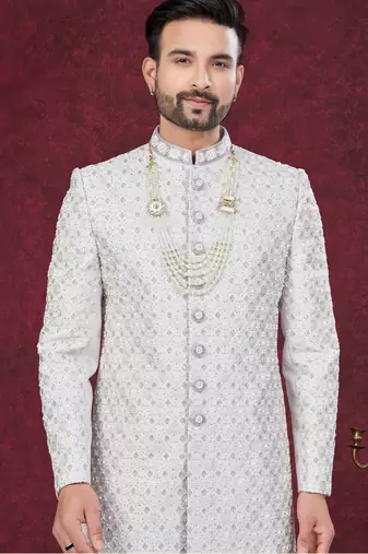 Grey off white embroidered jacket attached indo-western sherwani set with thread, stone & fancy button work.