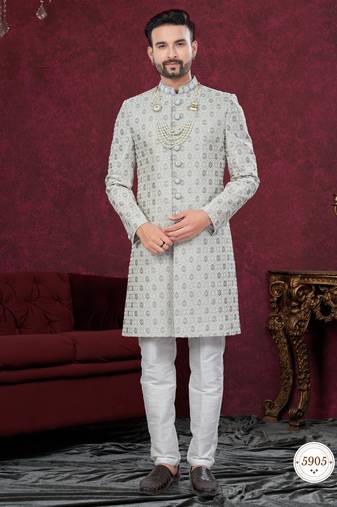 Grey embroidered jacket attached indo-western sherwani set with thread, stone & fancy button work.