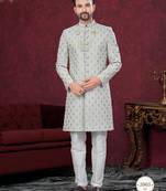 Grey embroidered jacket attached indo-western sherwani set with thread, stone & fancy button work.