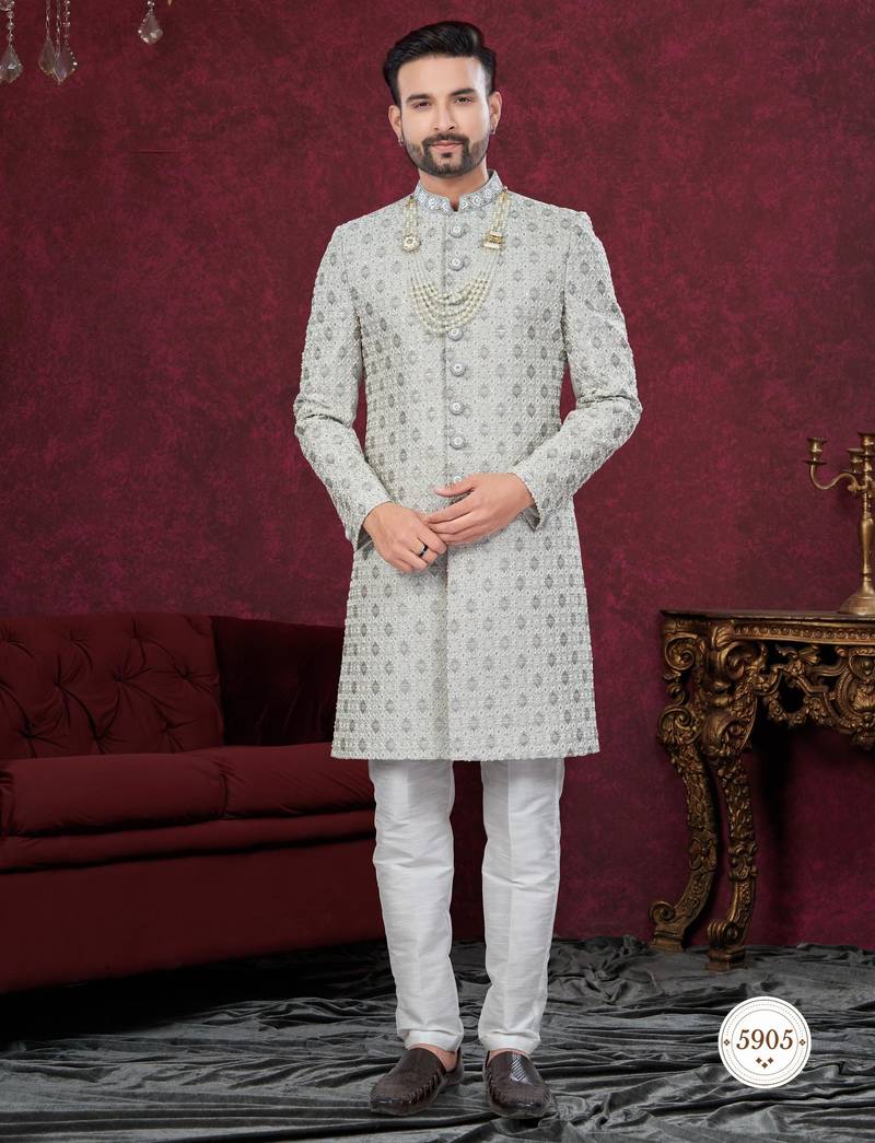 Grey embroidered jacket attached indo-western sherwani set with thread, stone & fancy button work.