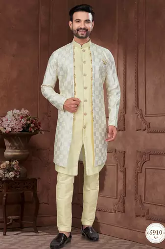 Light yellow embroidered jacket attached indo-western sherwani set with thread, stone & fancy button work.