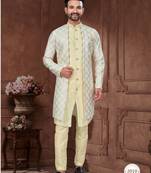 Light yellow embroidered jacket attached indo-western sherwani set with thread, stone & fancy button work.