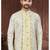 Light yellow embroidered jacket attached indo-western sherwani set with thread, stone & fancy button work.