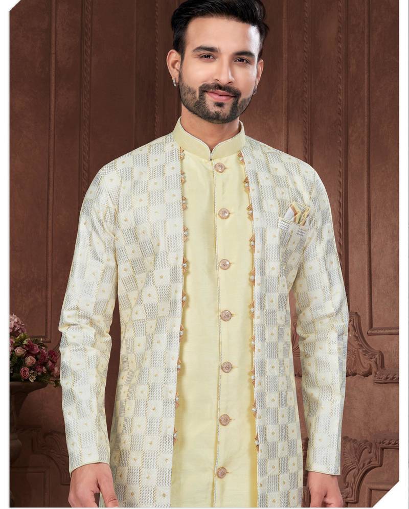 Light yellow embroidered jacket attached indo-western sherwani set with thread, stone & fancy button work.