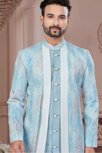 Blue embroidered jacket attached indo-western sherwani set with thread, stone & fancy button work.
