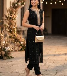 Women Embroidered Regular Kurta with Trousers