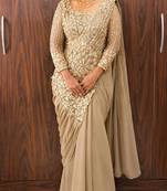 Cream embroidered pre-draped saree with designer blouse