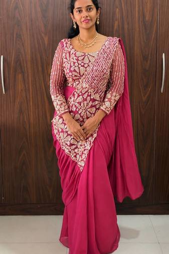 Hot pink embroidered pre-draped saree with designer blouse