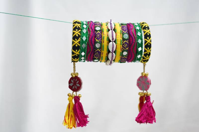 handcrafted multicolour kutchi boho bangle set with cowrie shells & tassels