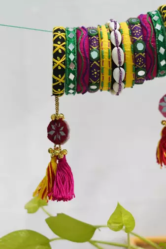  handcrafted multicolour kutchi boho bangle set with cowrie shells & tassels