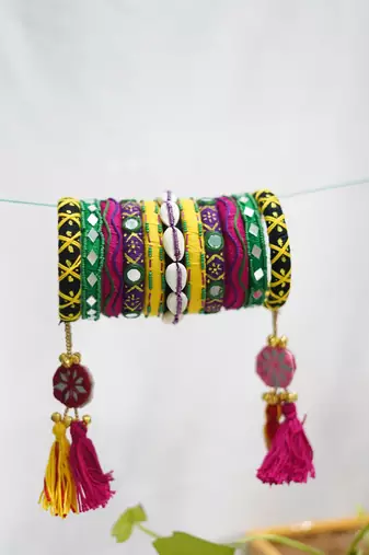  handcrafted multicolour kutchi boho bangle set with cowrie shells & tassels