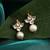 White stone pearl drop kundan stud earrings