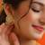 White stone green beaded kundan stud earrings