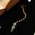 Green kundan floral teardrop maang tikka