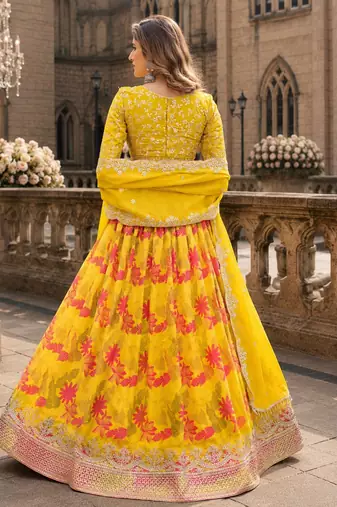 Yellow art silk semi stitched lehenga choli with taby silk print