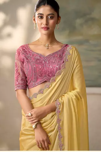 Yellow luxurious party wear saree