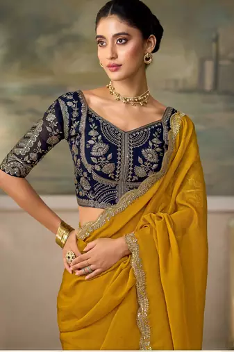 Yellow luxurious party wear saree