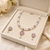 Pearl & pink stone necklace & earrings jewellery set teardrop pendant, cz accents, magnetic clasp, bridal wear.