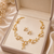 Pearl & cz floral necklace & earrings jewellery set, gold tone