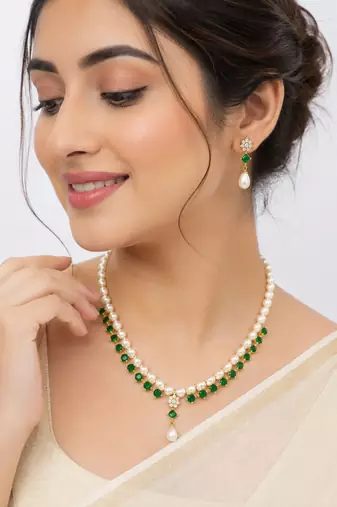 Pearl & emerald green stone necklace & earrings jewellery set gold-tone finish, teardrop pendant, cz stone accents.