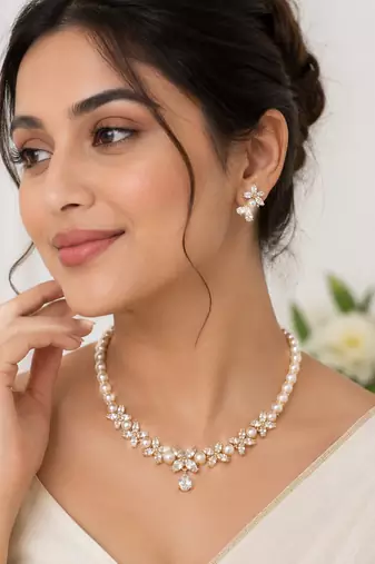 Pearl & cz floral necklace & earrings jewellery set gold-tone finish,cubic zirconia stones,bridal wear,teardrop pendant.