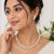 Pearl & cz floral necklace & earrings jewellery set gold-tone finish,cubic zirconia stones,bridal wear,teardrop pendant.