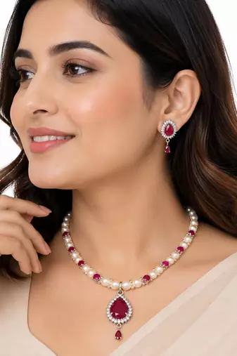 Pearl & ruby stone necklace set with matching earrings teardrop pendant, cz stone accents, pearl str& chain.