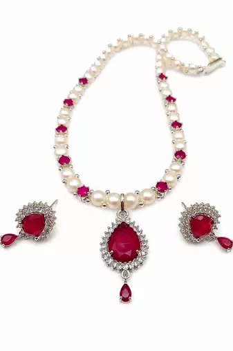 Pearl & ruby stone necklace set with matching earrings teardrop pendant, cz stone accents, pearl str& chain.