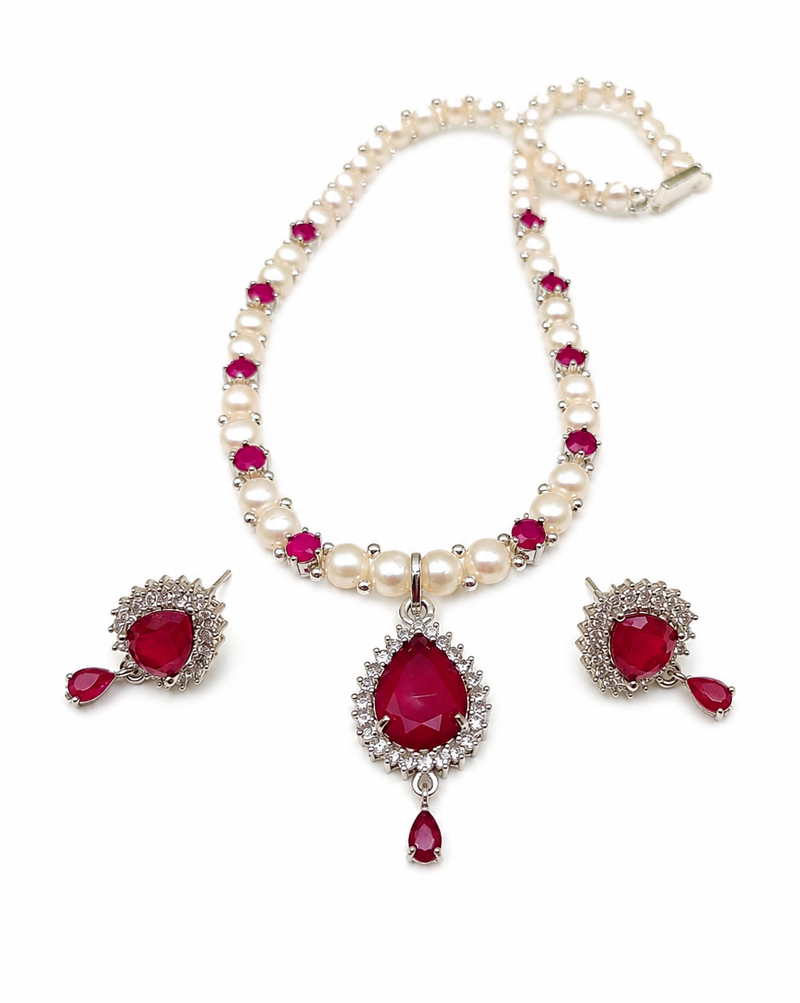 Pearl & ruby stone necklace set with matching earrings teardrop pendant, cz stone accents, pearl str& chain.