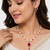 Pearl & ruby stone necklace & earrings jewellery set gold-tone finish,teardrop pendant, bridal wear, white pearl strand.