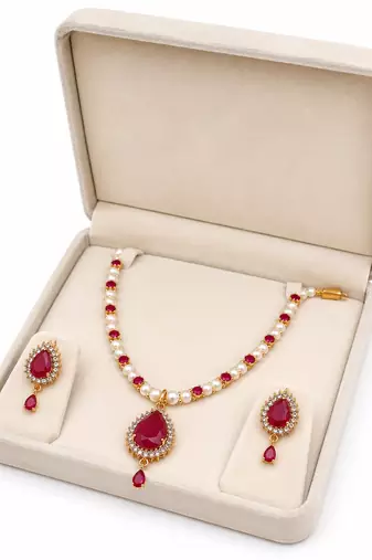 Pearl & ruby stone necklace & earrings jewellery set gold-tone finish,teardrop pendant, bridal wear, white pearl strand.