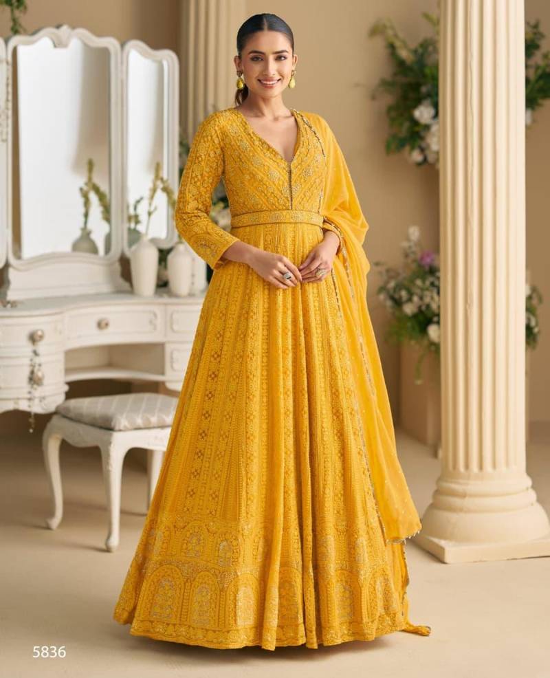 Yellow georgette embroidered flared gown set
