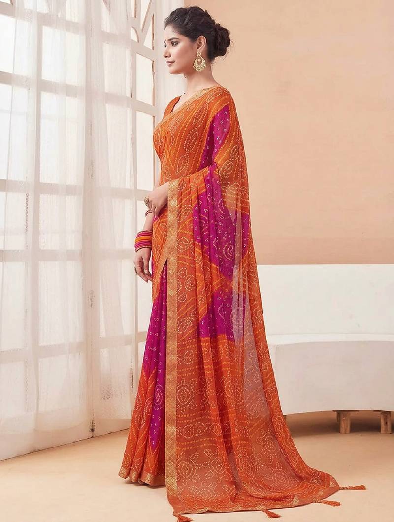 Women's orange bandhani print chiffon bandhej style saree with matching blouse