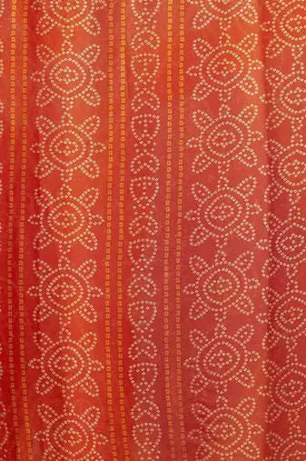 Women's orange bandhani print chiffon bandhej style saree with matching blouse
