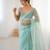 Mint net embellished saree with unstitched blouse piece.