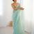 Mint net embellished saree with unstitched blouse piece.