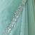 Mint net embellished saree with unstitched blouse piece.