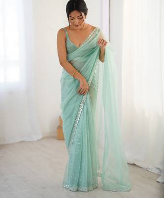 Mint net embellished saree with unstitched blouse piece. 5