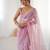 Pink net embellished saree with unstitched blouse piece.