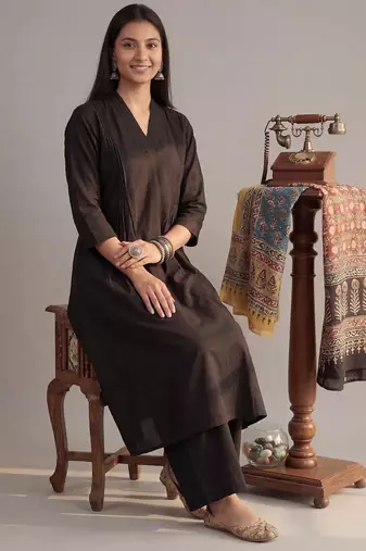 black solid a-line design features pintuck pleats kurta palazzo set