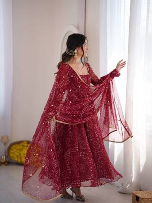 Women maroon bandhani print anarkali kurta with pent & dupatta 4